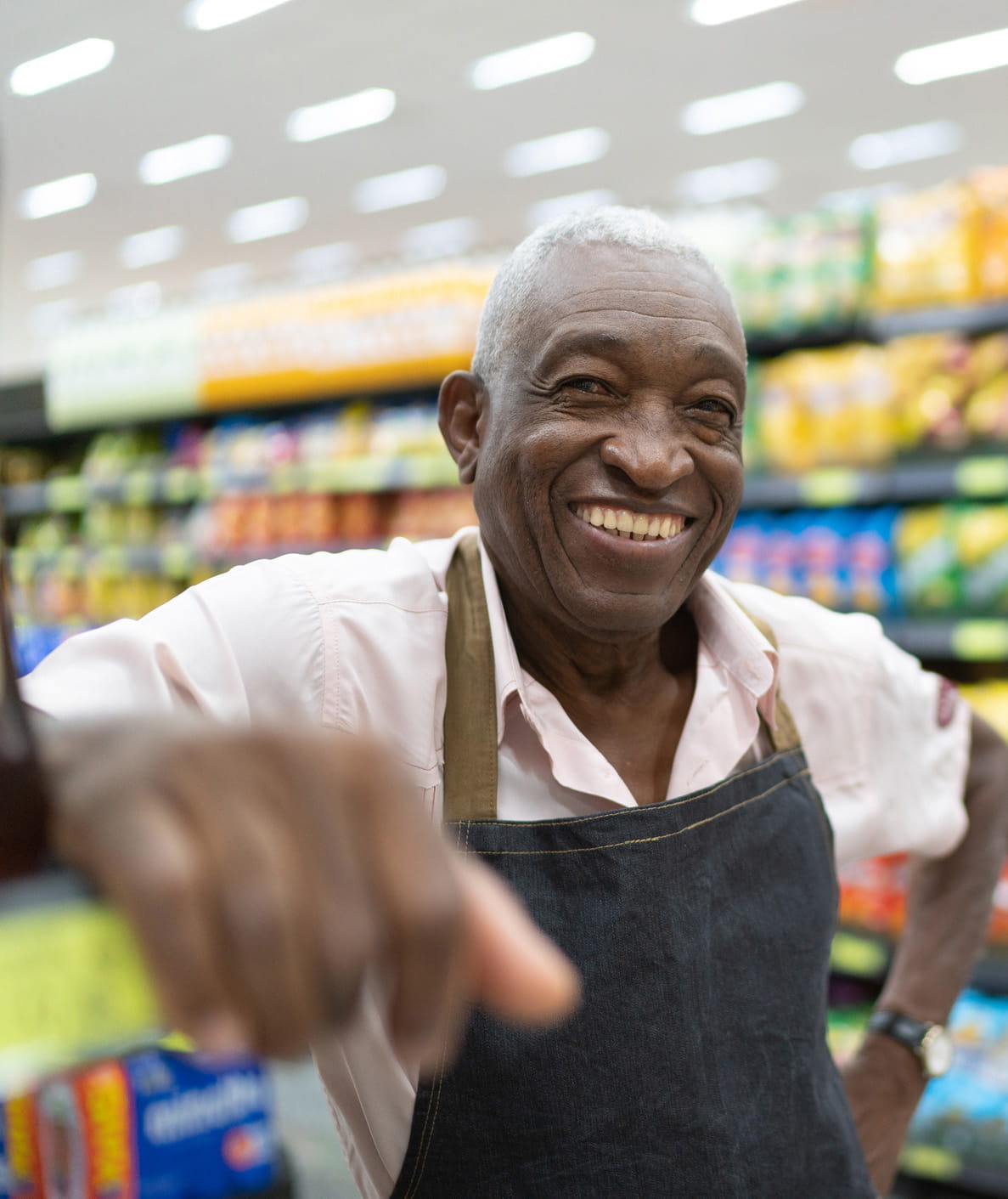 Happy worker in grocery stoore