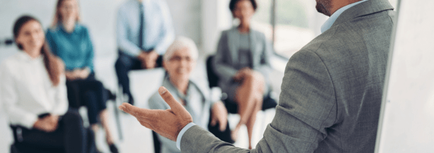 Employer giving a presentation to employees.
