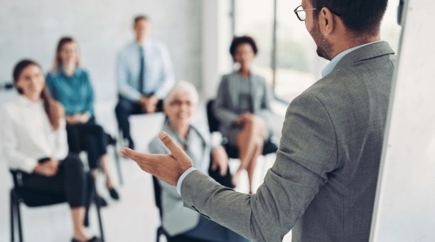 Employer giving a presentation to employees.