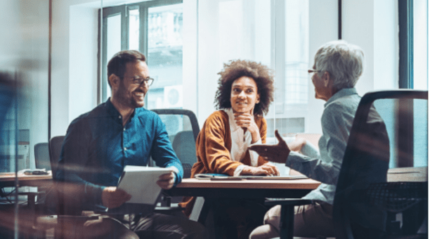 Group of employees meet