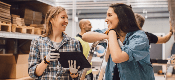 Two employees discuss benefits
