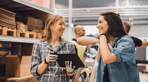 Two employees discuss benefits