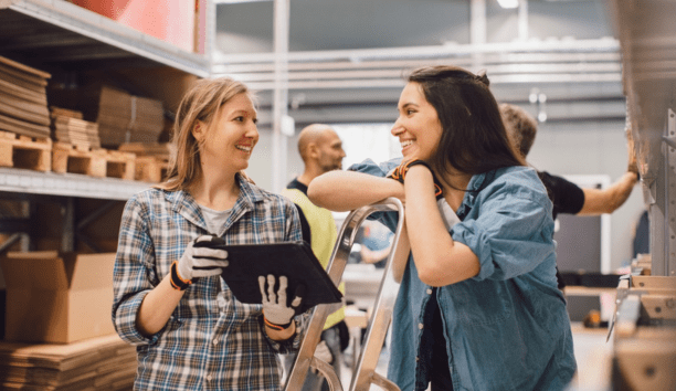 Two employees discuss benefits